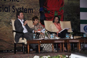 Grameen Foundation President and CEO Alex Counts (lefts) speaks about the Indian microfinance sector at the Sa-Dhan Conference held earlier this month in that country. With him on stage are Jayshree Vyas (center), Managing Director of SEWA Bank, who served as the moderator, and Sujata Lamba of the World Bank.